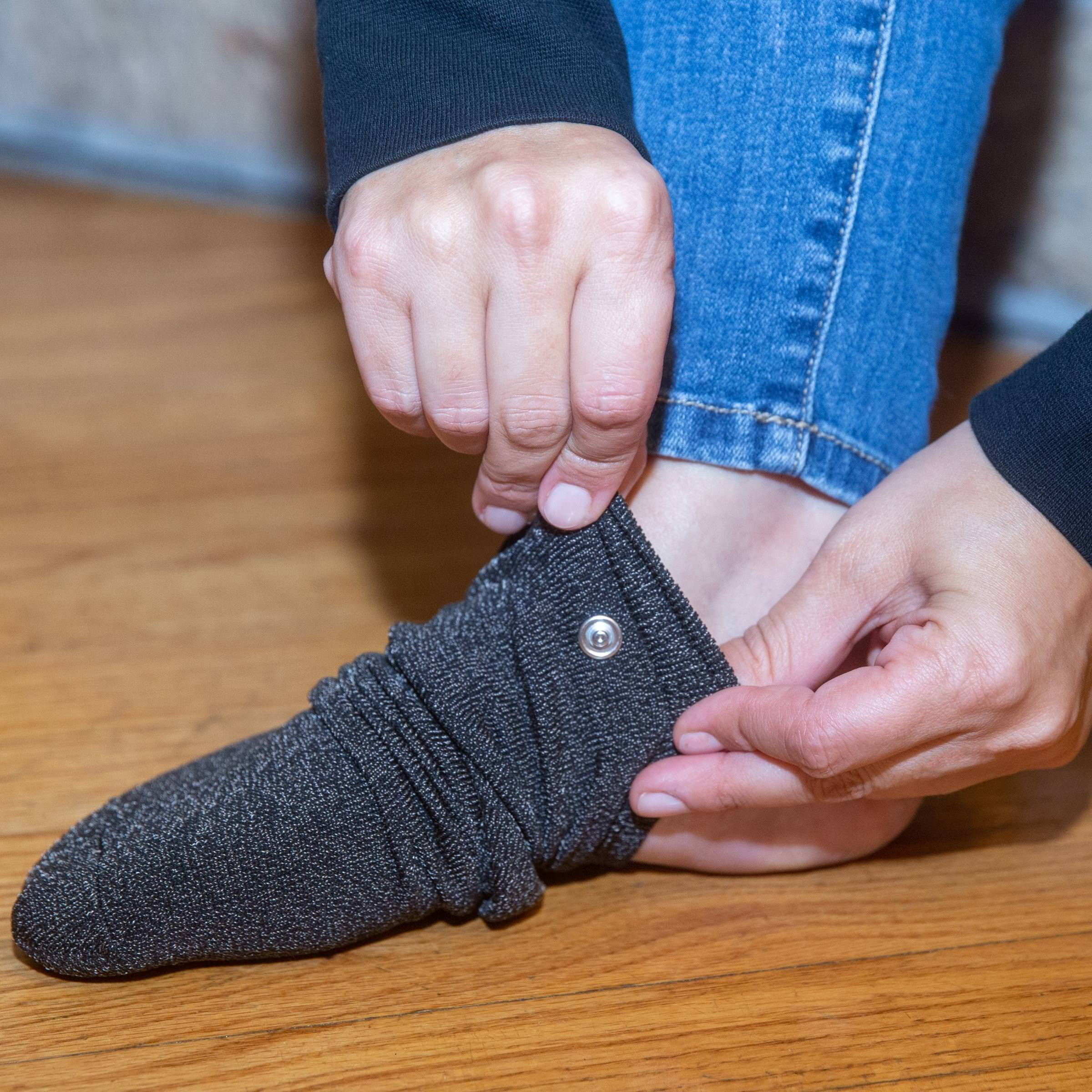 Arthing Grounded Sock Putting On.Jpg